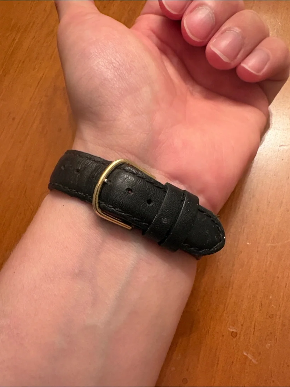 Movado Gold Dial Watch with Black Leather Strap